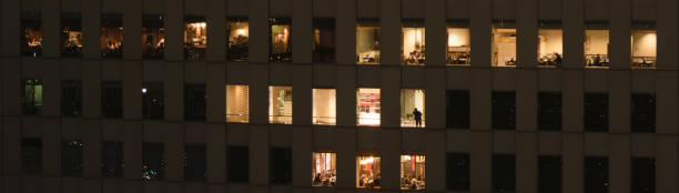 istock People busy in a skyscraper at night 2153748787
