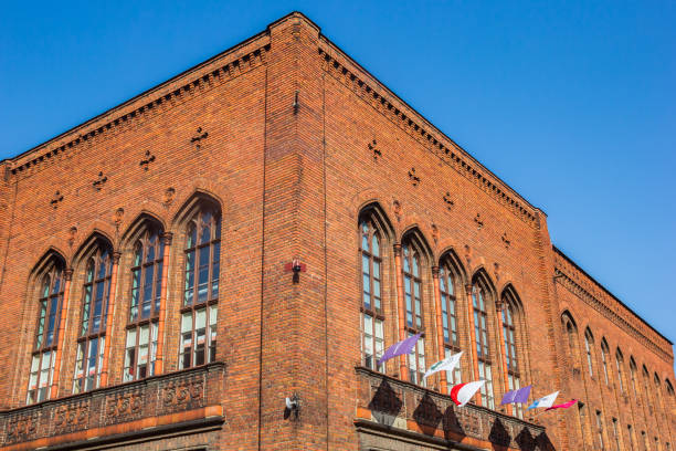 Flags on the facade of the Copernicus school in Torun, Poland