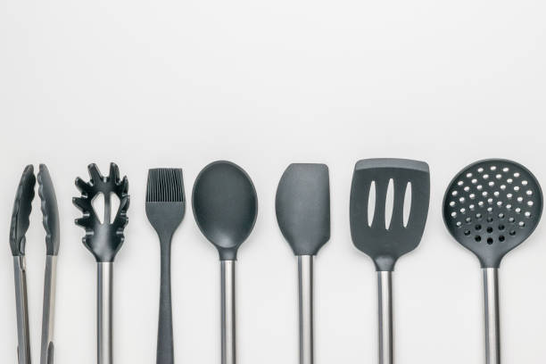 istock Minimalist Kitchen Utensils Collection: Black and Stainless Steel Cooking Tools on White Background 2153749336