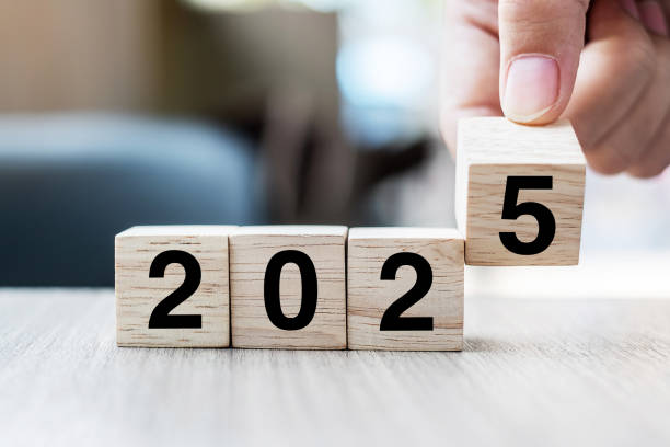 istock hand flipping block 2024 to 2025 text on table. Resolution, strategy, plan, goal, motivation, reboot, business and New Year holiday concepts 2153754013