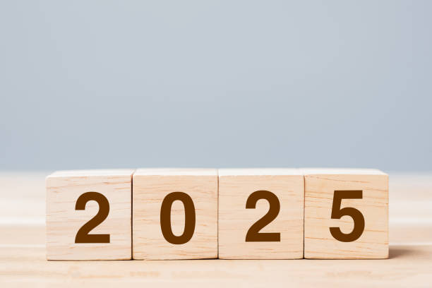 istock wooden cube block with 2025 text on table background. Resolution, plan, review, goal, start and New Year holiday concepts 2153754065