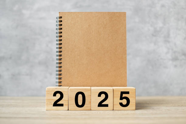 istock 2025 Happy New Year with blank notebook and wooden number. countdown, Resolution, Goals, Plan, Action and Mission Concept 2153754095