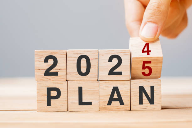 istock hand flipping block 2024 to 2025 PLAN text on table. Resolution, strategy, goal, motivation, reboot, business and New Year holiday concepts 2153754167