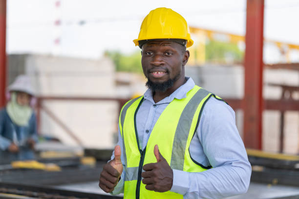 istock Engineer man with doing thumbs up gesture, Cheerful foreman worker on a construction site 2153754826