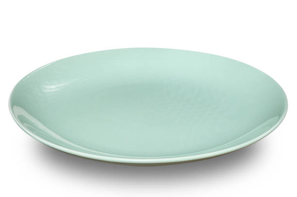istock Green circle ceramics plate isolated on white background. 2153755025