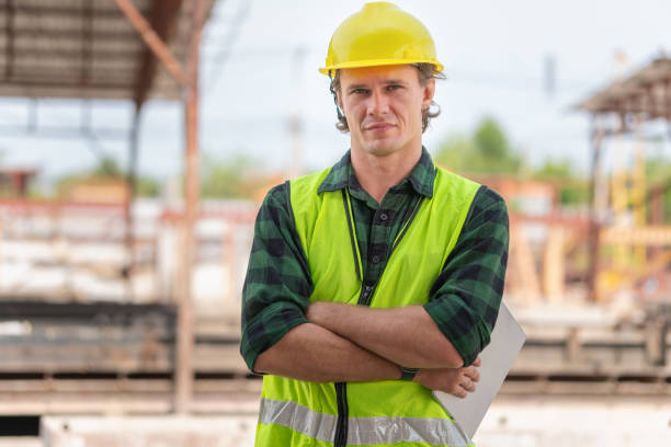 istock Engineer man arms crossed with digital tablet checking project in the precast concrete factory site, Foreman worker at construction site 2153757446