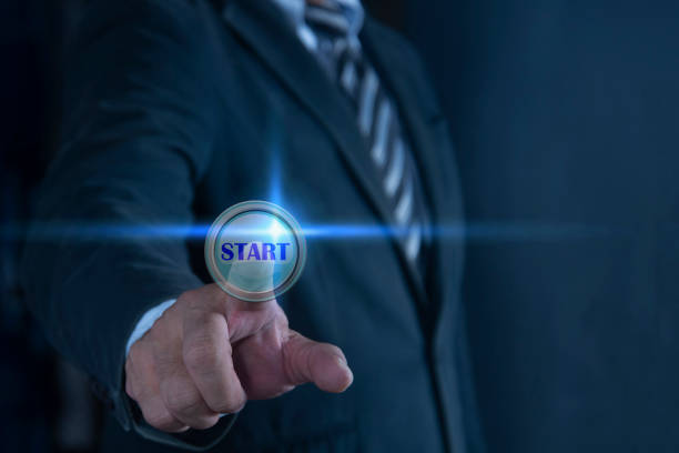 Businessman pressing button on virtual screen. Man pointing at a futuristic interface. Digital communication and virtual technology concept.