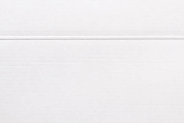 istock White cardboard sheet texture background, detail of recycle paper box pattern. 2153758170