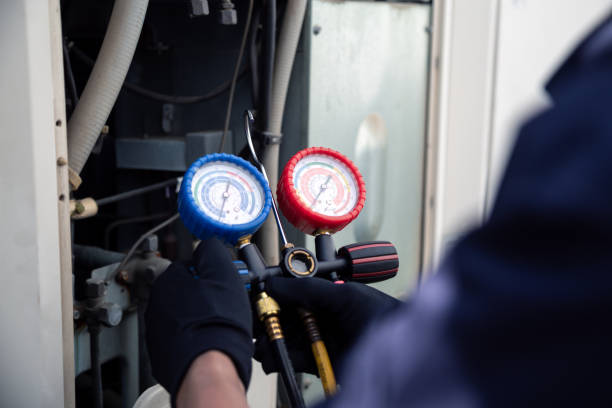 istock Air conditioning, HVAC service technician using gauges to check refrigerant and add refrigerant,Air Conditioning Repair, repairman on the floor fixing air conditioning system. 2153758506