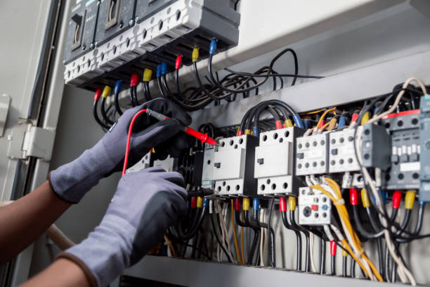 istock Electricity and electrical maintenance service,Electrical tests industrial electrical circuits with a multimeter in the control terminal box. 2153758516