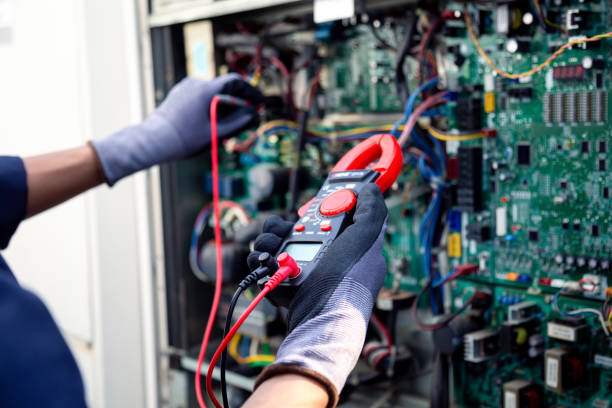 istock Air conditioning technicians and those preparing to install new air conditioners use a multimeter to check the operation of the compressor control panel system. 2153758520