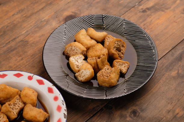 istock Tahu gejrot is a typical food from Cirebon, West Java, Indonesia, made from tofu that has been fried and then eaten with a sauce consisting of chili, garlic, shallots and sugar. Indonesian food 2153761588
