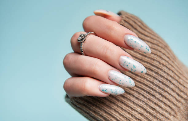 Female hands with blue nail design. Blue nail polish manicure.