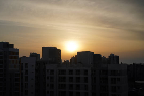 Silhouette of an apartment building at sunset