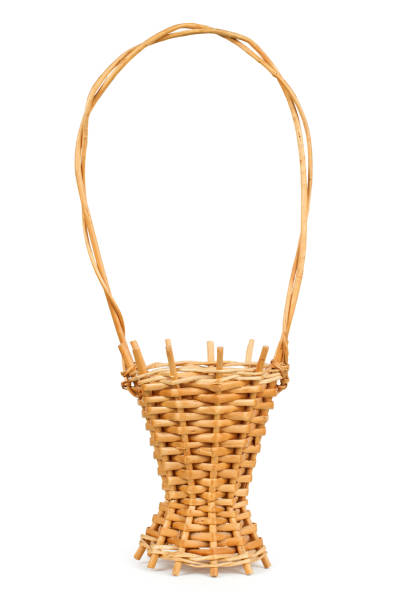 istock A decorative flower basket woven from vine on a white background. 2153764346