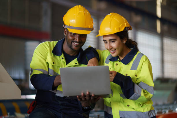 Engineer, Workers in a busy warehouse engage in various tasks, showcasing a collaborative team effort in an industrial setting, with a focus on safety and efficient work practices