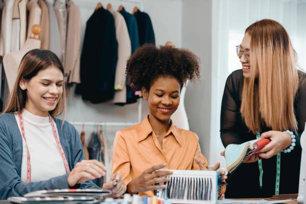 istock multi-ethnic designer group Discusses and exchange ideas for clothing design with intention and happiness. 2153764518