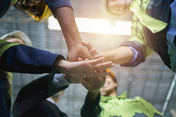 istock Diverse workers are putting their hands together, and multi-ethnic people stack of handsunity and teamwork concept. 2153764531