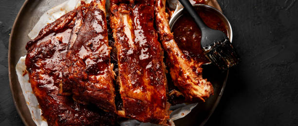 istock Grilled and smoked ribs with barbeque sauce. 2153766066