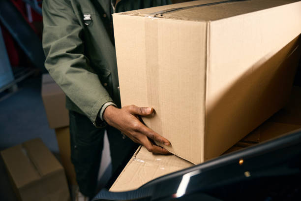 istock Man takes things out of a car in a storage service 2153768068
