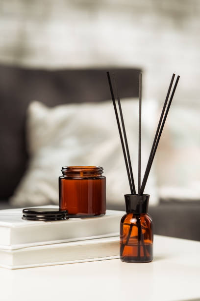 istock Aroma diffuser bottle with sticks in living room 2153770083