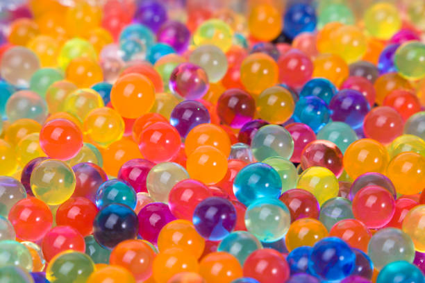 istock Hydrogel colored transparent balls orbeez, colorful background. Selective focus. 2153770720