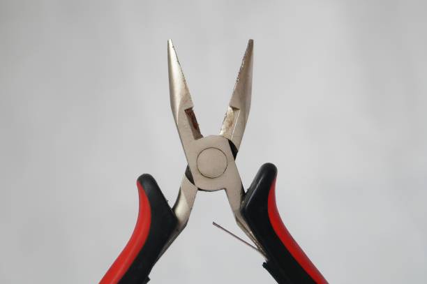 istock A pair of pliers with a red handle and a black handle 2153771267