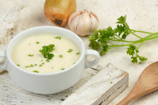 istock Bowl of cream soup on white table 2153771477