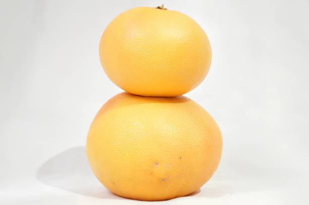 Red flesh of grapefruit on white background