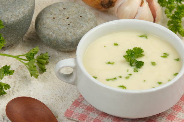 istock Bowl of cream soup on white table 2153772180