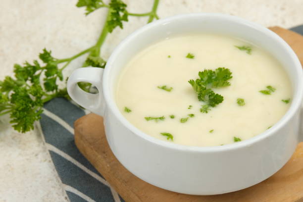 istock Bowl of cream soup on white table 2153772286