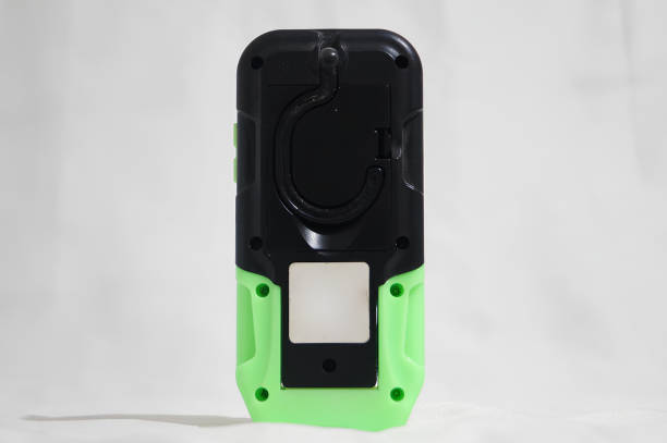 istock A green and black cell phone with a white background 2153772336