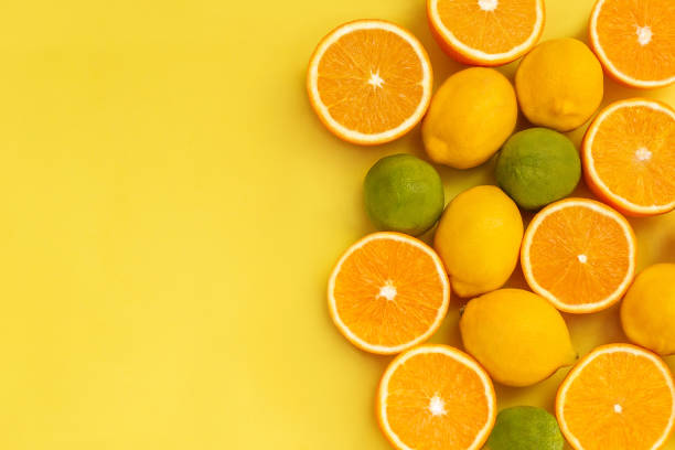 istock Citrus fruits isolated on yellow background. 2153772837