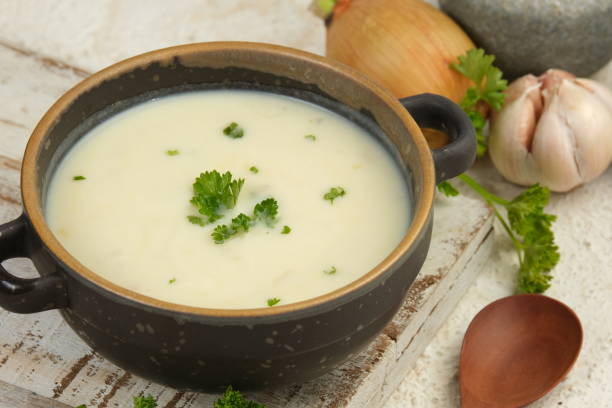 istock Bowl of cream soup on white table 2153773373