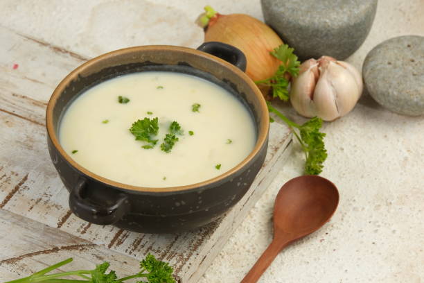 istock Bowl of cream soup on white table 2153774033
