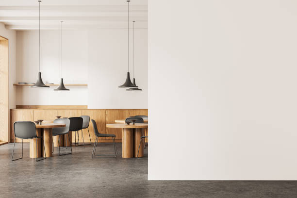 istock Stylish cafe interior with dining zone and kitchen shelves. Mock up wall 2153774102
