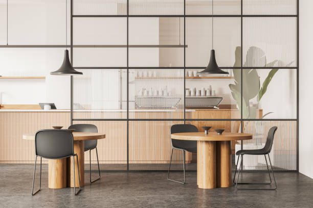 istock Modern cafeteria interior with dining zone and glass partition, kitchen space 2153774113
