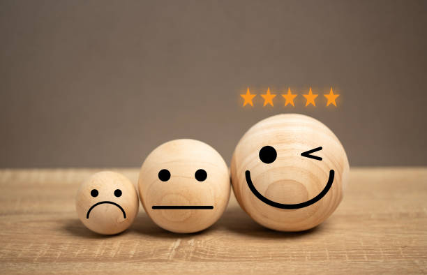 istock satisfaction icon on the table. the feedback for the customer give the rate star point for performance service quality. the survey marketing questionnaire. the choice of good adviser. 2153775129