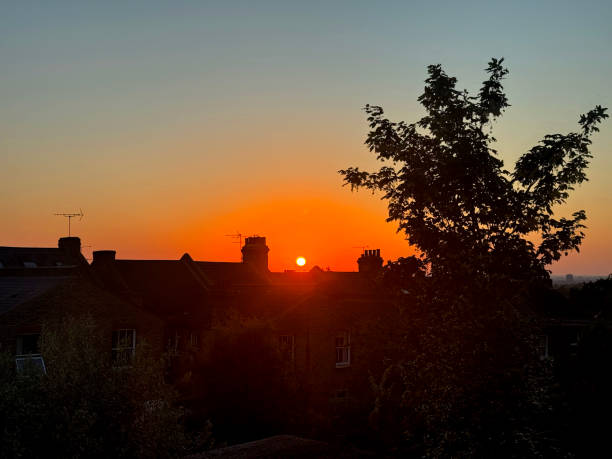 Sunset over terrace houses in London. May 2024