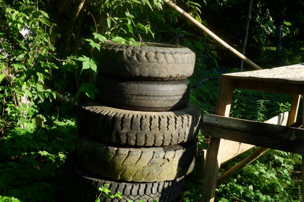 istock pile of mossy used car tires 2153777288