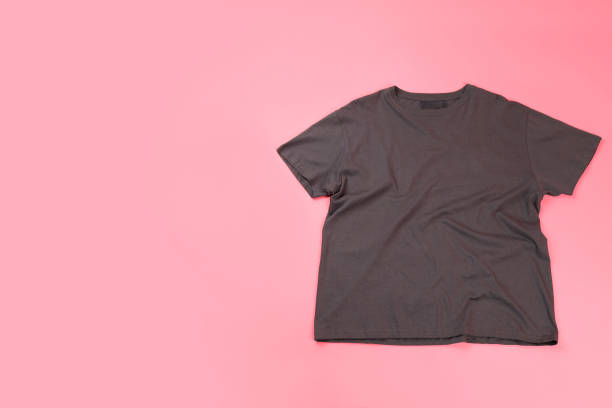istock Dark t-shirt with space for print on pink background 2153779106