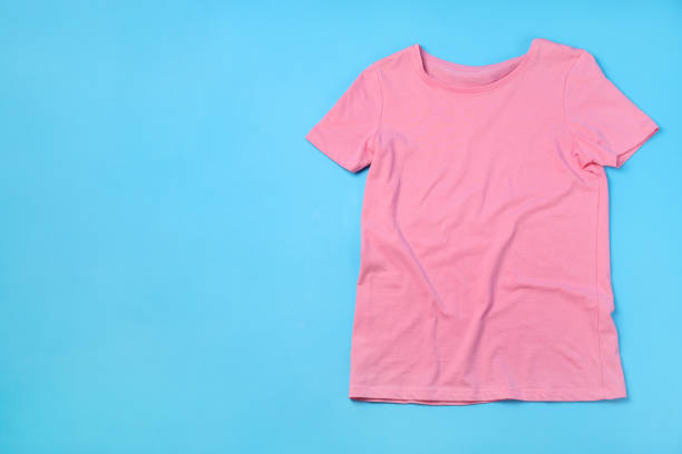 istock Blank pink t-shirt with space for print on blue background 2153779482