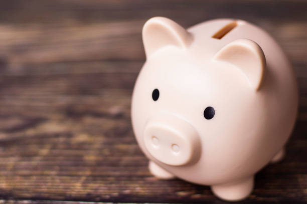 istock piggy bank on table background. 2153780447