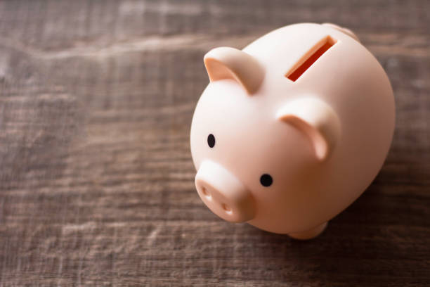 istock piggy bank on table background. 2153780497