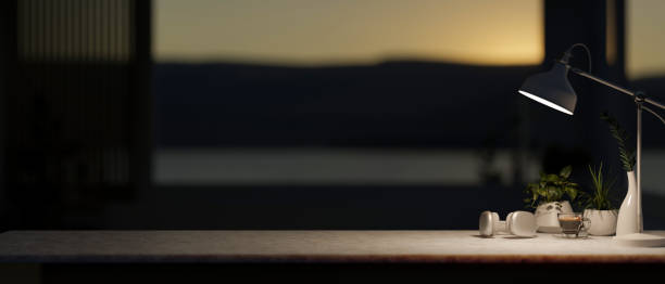 istock A table features a space for displaying products against the blurred, dark background in the room. 2153781036
