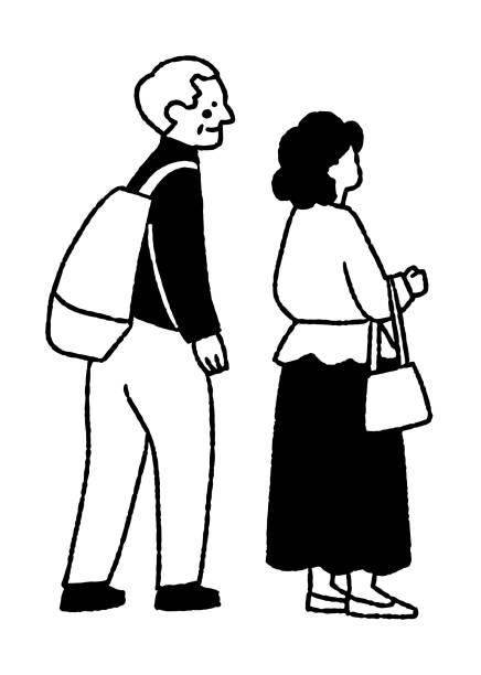 istock Elderly couple looking at a painting at an exhibition_2 2153781300