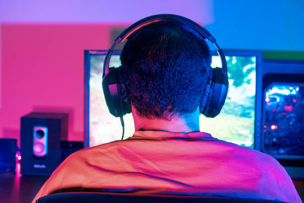 istock A gamer celebrating a victory with a triumphant pose, showing joy and excitement 2153781677