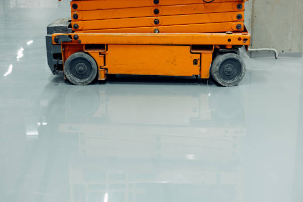 istock Scissor Lift Platforms On Finished Epoxy Floor, Polished Flooring 2153781839