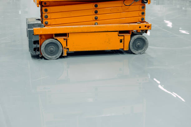 istock Scissor Lift Platforms with Polished Flooring, Epoxy Sleek Floor 2153781842