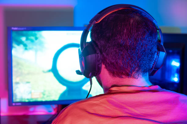 istock A gamer celebrating a victory with a triumphant pose, showing joy and excitement 2153781998